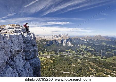 "Mountain climber on Kreuzkofelscharte Mountain, overlooking Val Badia towards the Puez Group and Peitlerkofel Mountain, Dolomites, Alto Adige, Italy, Europe" View Large Photo Image Stock Image - "Mountain climber on Kreuzkofelscharte Mountain, overlooking Val Badia towards the Puez Group and Peitlerkofel Mountain, Dolomites, Alto Adige, Italy, Europe". Fotosearch