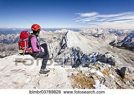 "Mountain climber on the peak of Zehnerspitze Mountain in the Fanes Group, Fanes-Senes-Prague Nature Park, looking towards Neuner Mountain, Val Badia, Dolomites, Alto Adige, Italy, Europe" View Large Photo Image Stock Photo - "Mountain climber on the peak of Zehnerspitze Mountain in the Fanes Group, Fanes-Senes-Prague Nature Park, looking towards Neuner Mountain, Val Badia, Dolomites, Alto Adige, Italy, Europe". Fotosearch