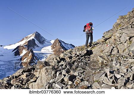 "Mountain climber on the Richterweg hiking trail, looking towards Weisskugel Mountain, Langtaufers, Alta Val Venosta or Upper Vinschgau Valley, Alto Adige, Italy, Europe" View Large Photo Image Stock Image - "Mountain climber on the Richterweg hiking trail, looking towards Weisskugel Mountain, Langtaufers, Alta Val Venosta or Upper Vinschgau Valley, Alto Adige, Italy, Europe". Fotosearch