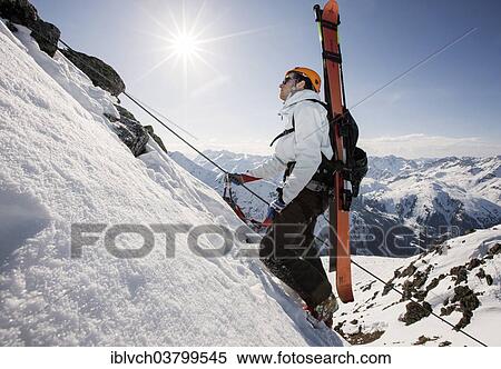 Stock Photography - "Mountain climber on the Winterklettersteig climbing route, Arlberg, Verwall Group, North Tyrol, Austria, Europe". Fotosearch