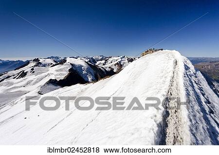 "Mountain climber on the summit of Monte Cevedale, looking towards Monte Vioz, Alto Adige, Italy, Europe" View Large Photo Image Stock Photo - "Mountain climber on the summit of Monte Cevedale, looking towards Monte Vioz, Alto Adige, Italy, Europe". Fotosearch