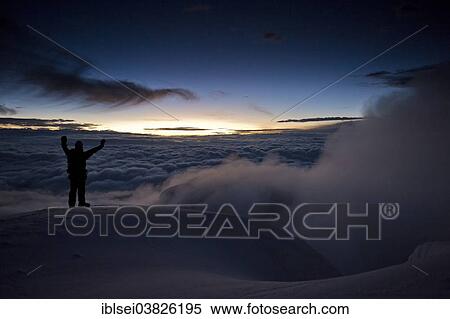 Stock Photography - "Mountain climber on the summit of Cotopaxi Volcano at sunrise, Quito, Ecuador, South America". Fotosearch
