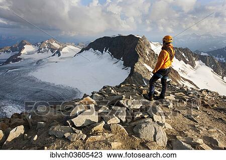 "Mountain climber standing at the summit of Wilder Pfaff Mountain looking towards Alto Adige, Stubai Valley, Stubai Alps, Tyrol, Austria, Europe" View Large Photo Image Stock Image - "Mountain climber standing at the summit of Wilder Pfaff Mountain looking towards Alto Adige, Stubai Valley, Stubai Alps, Tyrol, Austria, Europe". Fotosearch