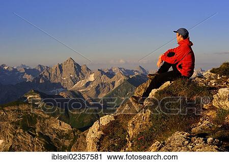 "Mountain climber with a mountain panorama, Geisshorn Mountain, Tannheim Valley, Tyrol, Austria, Europe" View Large Photo Image Stock Image - "Mountain climber with a mountain panorama, Geisshorn Mountain, Tannheim Valley, Tyrol, Austria, Europe". Fotosearch
