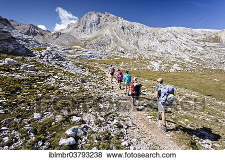 "Mountain climbers ascending Lavarela Massif, with Lavarella Saddle at the rear, Fanes-Sennes-Prags Nature Park, Val Badia, Dolomites, Alto Adige, Italy, Europe" View Large Photo Image Stock Photo - "Mountain climbers ascending Lavarela Massif, with Lavarella Saddle at the rear, Fanes-Sennes-Prags Nature Park, Val Badia, Dolomites, Alto Adige, Italy, Europe". Fotosearch