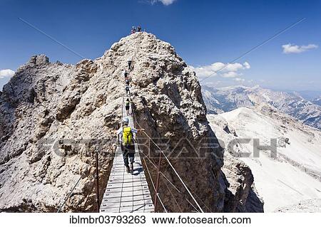 "Mountain climbers ascending Cristallino Mountain on the Via Ferrata Ivano Dibona climbing route on Monte Cristallo, Dolomites, Belluno Province, Italy, Europe" View Large Photo Image Stock Image - "Mountain climbers ascending Cristallino Mountain on the Via Ferrata Ivano Dibona climbing route on Monte Cristallo, Dolomites, Belluno Province, Italy, Europe". Fotosearch