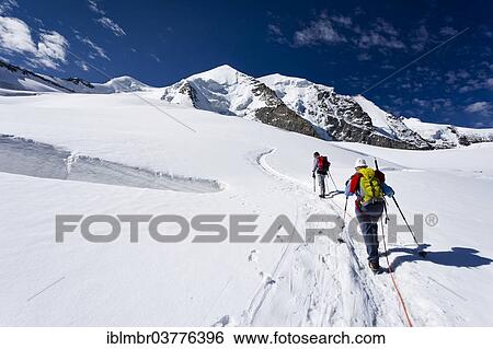 "Mountain climbers ascending to Piz Palu Mountain, Grisons, Switzerland, Europe" View Large Photo Image Stock Photograph - "Mountain climbers ascending to Piz Palu Mountain, Grisons, Switzerland, Europe". Fotosearch