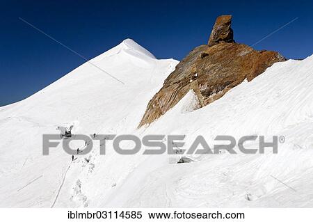 "Mountain climbers climbing along the ridge of Zufallspitze Mountain towards Monte Cevedale, summit of Monte Cevedale at the rear, South Tyrol province, Trentino-Alto Adige, Italy, Europe" View Large Photo Image Stock Photography - "Mountain climbers climbing along the ridge of Zufallspitze Mountain towards Monte Cevedale, summit of Monte Cevedale at the rear, South Tyrol province, Trentino-Alto Adige, Italy, Europe". Fotosearch