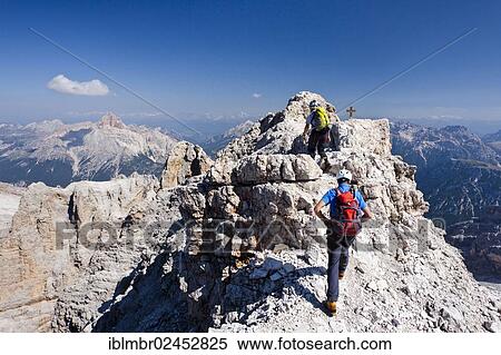 "Mountain climbers decending along the Via Ferrata Marino Bianchi climbing route on Mount Cristallo, looking towards Hohe Gaisl Mountain, Belluno, Dolomites, Italy, Europe" View Large Photo Image Stock Photography - "Mountain climbers decending along the Via Ferrata Marino Bianchi climbing route on Mount Cristallo, looking towards Hohe Gaisl Mountain, Belluno, Dolomites, Italy, Europe". Fotosearch