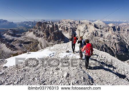 "Mountain climbers descending from Tofana di Rozes Mountain, overlooking the Sella Group and Gardena Pass, Dolomites, Belluno, Italy, Europe" View Large Photo Image Stock Image - "Mountain climbers descending from Tofana di Rozes Mountain, overlooking the Sella Group and Gardena Pass, Dolomites, Belluno, Italy, Europe". Fotosearch