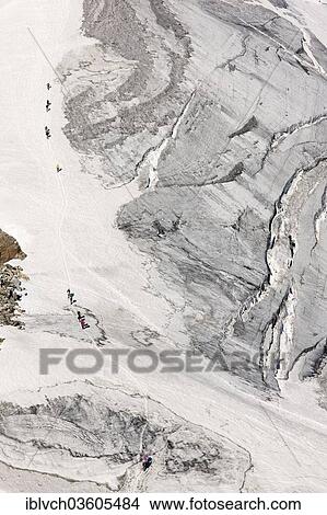 "Mountain climbers during the ascent of Zuckerhuetl Mountain, Stubai Valley, Stubai Alps, Tyrol, Austria, Europe" View Large Photo Image Picture - "Mountain climbers during the ascent of Zuckerhuetl Mountain, Stubai Valley, Stubai Alps, Tyrol, Austria, Europe". Fotosearch