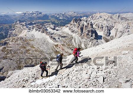 "Mountain climbers during the ascent of Mt Tofana di Roze on the Via Ferrata Giovanni Lipella, Sella Massif at back, Dolomites, Alpen, Province of Belluno, Veneto, Italy, Europe" View Large Photo Image Stock Image - "Mountain climbers during the ascent of Mt Tofana di Roze on the Via Ferrata Giovanni Lipella, Sella Massif at back, Dolomites, Alpen, Province of Belluno, Veneto, Italy, Europe". Fotosearch