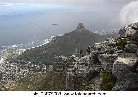 Stock Photo - "Mountain climbers on Table Mountain, overlooking Lion's Head, Cape Town, Western Cape, South Africa, Africa". Fotosearch