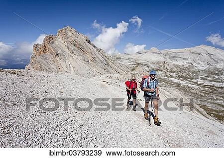 "Mountain climbers on the Lavarella Saddle, in front of Heiligkreuzkofel Mountain and Zehner Mountain, Val Badia, Dolomites, Alto Adige, Italy, Europe" View Large Photo Image Stock Photo - "Mountain climbers on the Lavarella Saddle, in front of Heiligkreuzkofel Mountain and Zehner Mountain, Val Badia, Dolomites, Alto Adige, Italy, Europe". Fotosearch