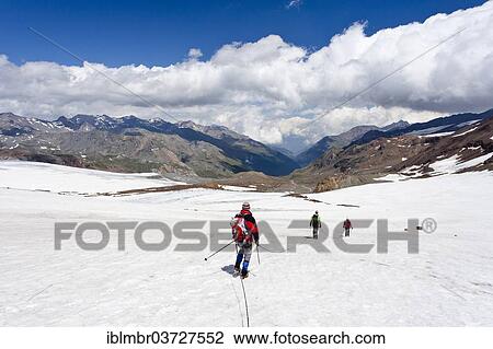 Stock Image - "Mountain climbers, roped together for safety on Zufallferner Glacier in Martelltal Valley, Provinz Sudtirol, Trentino-Sudtirol, Italien, Italy, Europe". Fotosearch