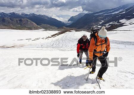 "Mountain climbers walking on the flank of Zufallferner Glacier in the Martell Valley above Marteller Huette hut, Alto Adige, Italy, Europe" View Large Photo Image Stock Image - "Mountain climbers walking on the flank of Zufallferner Glacier in the Martell Valley above Marteller Huette hut, Alto Adige, Italy, Europe". Fotosearch