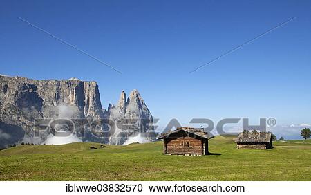 "Mountain huts, Schlern Massif or Sciliar Massif, Schlern or Sciliar, Seiser Alm or Alpe di Siusi, high alpine pasture, South Tyrol, Italy, Europe" View Large Photo Image Stock Image - "Mountain huts, Schlern Massif or Sciliar Massif, Schlern or Sciliar, Seiser Alm or Alpe di Siusi, high alpine pasture, South Tyrol, Italy, Europe". Fotosearch