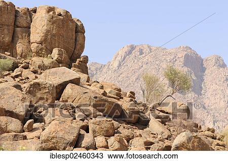 Stock Image - "Mountain landscape along a trail to the White Lady rock painting in the Tsisab Gorge, Brandberg, Damaraland, Namibia, Africa". Fotosearch