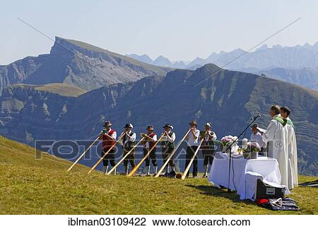Stock Image - "Mountain mass during a meeting of alphorn players, Diedamskopf, Schoppernau, Bregenzerwald, Bregenzer Wald, Vorarlberg, Austria, Europe". Fotosearch