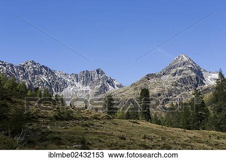 "Mountain panorama in Debanttal Valley, Gloedis Mountain at the rear right, Ralfkopf Mountain and Debantgrat ridge on the left, Tyrol, Austria, Europe" View Large Photo Image Stock Image - "Mountain panorama in Debanttal Valley, Gloedis Mountain at the rear right, Ralfkopf Mountain and Debantgrat ridge on the left, Tyrol, Austria, Europe". Fotosearch