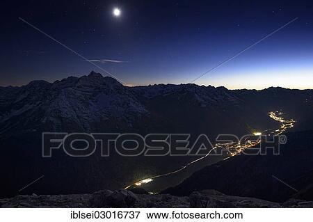 "Mountain panorama with the full moon and a view over the valley, Bach, Lechtal, Reutte Ausserfern, Tyrol, Austria, Europe" View Large Photo Image Stock Photo - "Mountain panorama with the full moon and a view over the valley, Bach, Lechtal, Reutte Ausserfern, Tyrol, Austria, Europe". Fotosearch