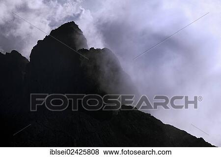 "Mountain peaks in clouds, Warth, Vorarlberg, Austria, Europe" View Large Photo Image Stock Photo - "Mountain peaks in clouds, Warth, Vorarlberg, Austria, Europe". Fotosearch