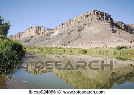 "Mountain range on the South African bank of the Oranje, Orange River, border river between Namibia and South Africa" View Large Photo Image Stock Photo - "Mountain range on the South African bank of the Oranje, Orange River, border river between Namibia and South Africa". Fotosearch