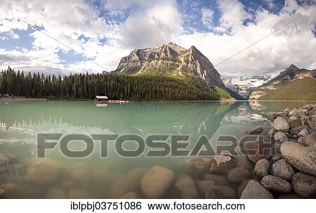 Stock Photograph - "Mountain reflected in Lake Louise, Banff National Park, Canada, North America". Fotosearch