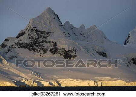 "Mountain scenery of Buttler Passage, evening light illuminating glacier calving, Danco Coast, Antarctic Peninsula, Antarctica" View Large Photo Image Stock Image - "Mountain scenery of Buttler Passage, evening light illuminating glacier calving, Danco Coast, Antarctic Peninsula, Antarctica". Fotosearch