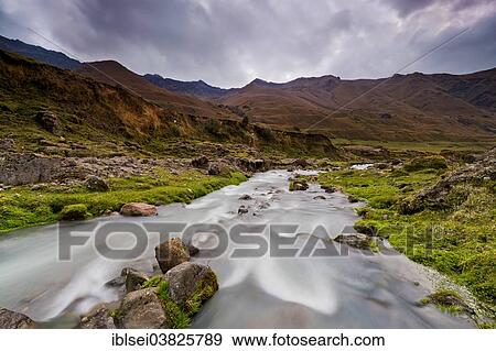 "Mountain stream with the peaks of El Altar or Kapak Urku, Riobamba, Region Cotopaxi, Ecuador, South America" View Large Photo Image Stock Photo - "Mountain stream with the peaks of El Altar or Kapak Urku, Riobamba, Region Cotopaxi, Ecuador, South America". Fotosearch
