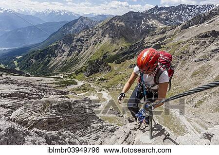 "Mountaineer asceding through the Imster Klettersteig ferrata on the Maldonkopf in the Lech Valley Alps, behind the Vorderes Alpjoch with the mountain station of the chairlift, Hochimst, Imst, Tyrol, Austria, Europe" View Large Photo Image Stock Photograph - "Mountaineer asceding through the Imster Klettersteig ferrata on the Maldonkopf in the Lech Valley Alps, behind the Vorderes Alpjoch with the mountain station of the chairlift, Hochimst, Imst, Tyrol, Austria, Europe". Fotosearch