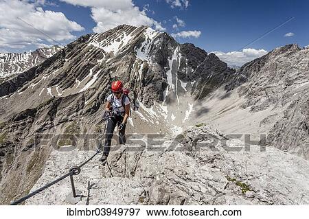 Stock Photo - "Mountaineer, ascent on the Imst ferrata on the Maldonkopf in the Lech Valley Alps, Hochimst, Imst, Tyrol, Austria, Europe". Fotosearch