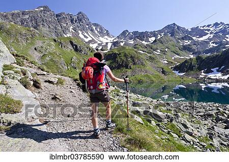 "Mountaineer at Grosser Schwarzsee Lake, Mt Schwarzwandscharte at back, South Tyrol, Trentino-Alto Adige, Italy, Europe" View Large Photo Image Stock Image - "Mountaineer at Grosser Schwarzsee Lake, Mt Schwarzwandscharte at back, South Tyrol, Trentino-Alto Adige, Italy, Europe". Fotosearch