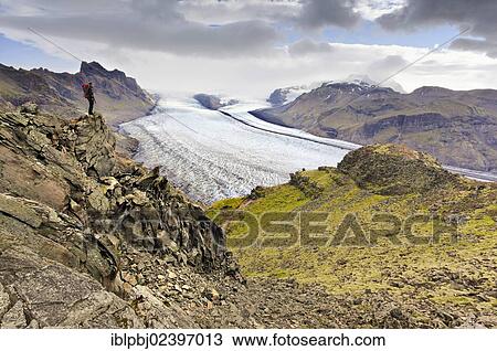 "Mountaineer in front of Vatnajoekull glacier tongue, Skaftafell, South Iceland, Iceland, Europe" View Large Photo Image Stock Image - "Mountaineer in front of Vatnajoekull glacier tongue, Skaftafell, South Iceland, Iceland, Europe". Fotosearch