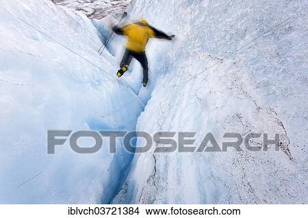 "Mountaineer jumping into a small crevasse on Matanuska Glacier, Matanuska Glacier, Alaska, United States, North America" View Large Photo Image Picture - "Mountaineer jumping into a small crevasse on Matanuska Glacier, Matanuska Glacier, Alaska, United States, North America". Fotosearch