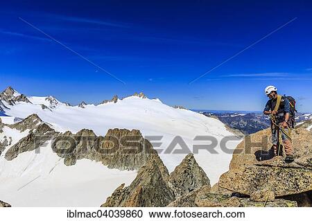 "Mountaineer on the summit of Le Portalet, Mont Blanc massif, Alps, Canton of Valais, Switzerland, Europe" View Large Photo Image Stock Image - "Mountaineer on the summit of Le Portalet, Mont Blanc massif, Alps, Canton of Valais, Switzerland, Europe". Fotosearch