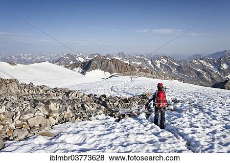 "Mountaineer on the summit of Mt Wilder Pfaff, Stubai Alps at back, South Tyrol, Trentino-Alto Adige, Italy, Europe" View Large Photo Image Stock Photo - "Mountaineer on the summit of Mt Wilder Pfaff, Stubai Alps at back, South Tyrol, Trentino-Alto Adige, Italy, Europe". Fotosearch