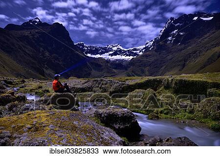 "Mountaineer sitting at a mountain stream with the peaks of El Altar or Kapak Urku, in moonlight, Riobamba, Region Cotopaxi, Ecuador, South America" View Large Photo Image Stock Image - "Mountaineer sitting at a mountain stream with the peaks of El Altar or Kapak Urku, in moonlight, Riobamba, Region Cotopaxi, Ecuador, South America". Fotosearch