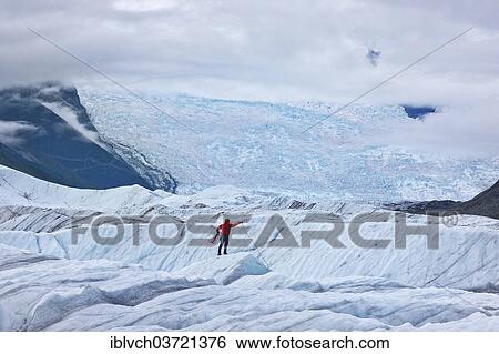 "Mountaineer standing on a glacier tongue, Wrangell–St. Elias National Park, Alaska, United States, North America" View Large Photo Image Stock Photograph - "Mountaineer standing on a glacier tongue, Wrangell–St. Elias National Park, Alaska, United States, North America". Fotosearch