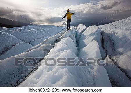"Mountaineer standing on Matanuska Glacier and pulling on a rope, Matanuska Glacier, Alaska, United States, North America" View Large Photo Image Stock Photography - "Mountaineer standing on Matanuska Glacier and pulling on a rope, Matanuska Glacier, Alaska, United States, North America". Fotosearch