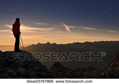 "Mountaineer, sunrise above the Inn Valley, Ehrwald, Tyrol, Austria, Europe" View Large Photo Image Stock Photograph - "Mountaineer, sunrise above the Inn Valley, Ehrwald, Tyrol, Austria, Europe". Fotosearch