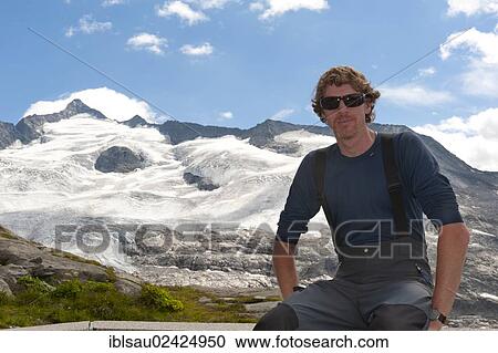 Mountaineer taking a rest, view from Kuersingerhuette refuge of Mt Grossvenediger, 3662 m, with the Obersulzbachkees Glacier near Neukirchen am Grossvenediger, Venediger Group, Hohe Tauern or High Tauern Range, Alps, State of Salzburg, Austria, Europe View Large Photo Image Stock Image - Mountaineer taking a rest, view from Kuersingerhuette refuge of Mt Grossvenediger, 3662 m, with the Obersulzbachkees Glacier near Neukirchen am Grossvenediger, Venediger Group, Hohe Tauern or High Tauern Range, Alps, State of Salzburg, Austria, Europe. Fotosearch