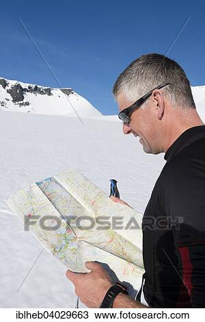 "Mountaineer with orientation map, Oppland, Norway, Europe" View Large Photo Image Stock Image - "Mountaineer with orientation map, Oppland, Norway, Europe". Fotosearch