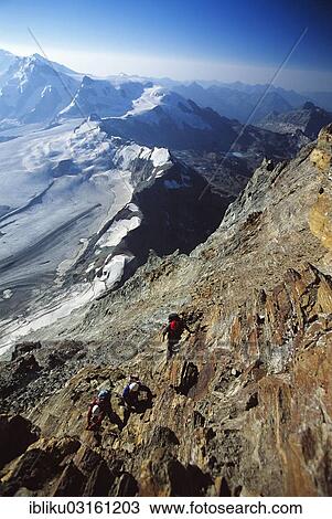 "Mountaineers ascending on the Matterhorn normal route at Hoernli Ridge, view of the Theodul Glacier and the Monte Rosa massif, Zermatt, Upper Valais, Canton of Valais, Switzerland, Europe" View Large Photo Image Stock Image - "Mountaineers ascending on the Matterhorn normal route at Hoernli Ridge, view of the Theodul Glacier and the Monte Rosa massif, Zermatt, Upper Valais, Canton of Valais, Switzerland, Europe". Fotosearch