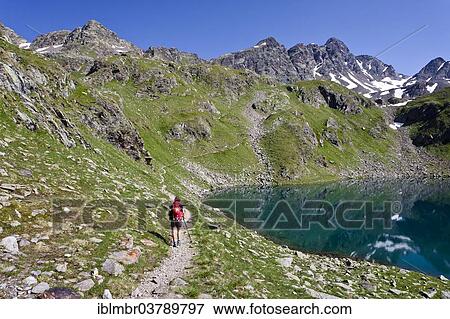 "Mountaineers at the Grosser Schwarzsee, ascent to Zuckerhuetl, behind Schwarzwandscharte with the Hofmannspitze, South Tyrol, Italy, Europe" View Large Photo Image Stock Photo - "Mountaineers at the Grosser Schwarzsee, ascent to Zuckerhuetl, behind Schwarzwandscharte with the Hofmannspitze, South Tyrol, Italy, Europe". Fotosearch