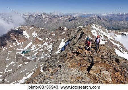 Stock Image - "Mountaineers during the ascent to Mt Hintere Eggenspitze via the summit ridge, in Ultental Valley or Val d'Ultimo, South Tyrol, Italy, Europe". Fotosearch