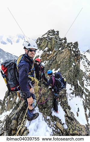 "Mountaineers roped together on the summit ridge of the Aiguille du Genepi, Mont Blanc massif, Canton of Valais, Switzerland, Europe" View Large Photo Image Stock Photography - "Mountaineers roped together on the summit ridge of the Aiguille du Genepi, Mont Blanc massif, Canton of Valais, Switzerland, Europe". Fotosearch