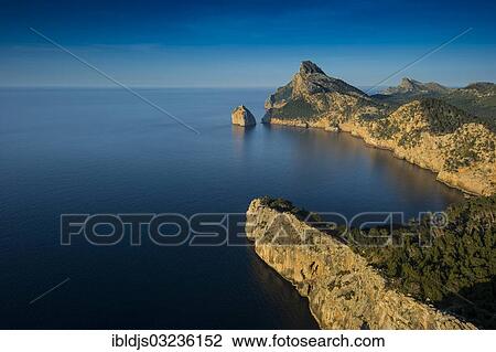 "Mountains and sea at Cap Formentor in the evening light, Pollenca, Serra de Tramuntana, Majorca, Balearic Islands, Spain, Europe" View Large Photo Image Stock Image - "Mountains and sea at Cap Formentor in the evening light, Pollenca, Serra de Tramuntana, Majorca, Balearic Islands, Spain, Europe". Fotosearch