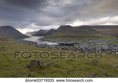 "Mountains, fjord in the evening light, port and city, Klaksvik, Borooy, Norooyar, Faroe Islands, Denmark, Europe" View Large Photo Image Stock Image - "Mountains, fjord in the evening light, port and city, Klaksvik, Borooy, Norooyar, Faroe Islands, Denmark, Europe". Fotosearch