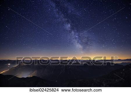 "Mountains in the evening light with Milky Way and stars, Warth, Vorarlberg, Austria, Europe" View Large Photo Image Picture - "Mountains in the evening light with Milky Way and stars, Warth, Vorarlberg, Austria, Europe". Fotosearch